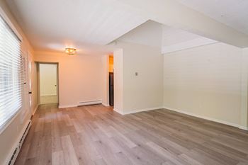 an empty living room with wood floors at Woodbury, Woodbury, Connecticut